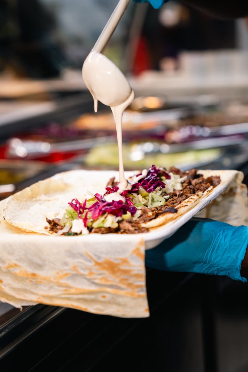 Shawarma laffa wrap with tahini drizzle